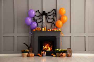 Room with fireplace decorated for Halloween. Festive interior