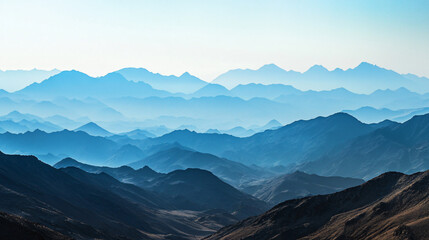 A panoramic view of a vast mountain range stretching across the horizon.