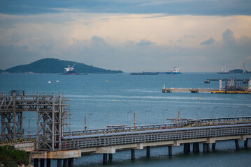 Obraz premium Logistic shipping quay boat Engineering crane depot at logistic export terminal control. Warehouse freight background container yard loading quayside harbor port. Logistics seascape shipping portal