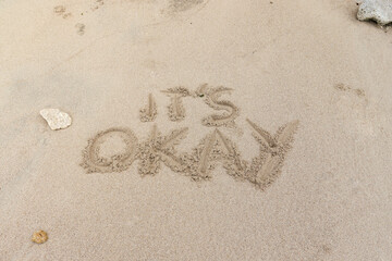 Motivation quotes it is okay written in the sand of the beach