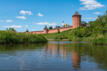 View of the Spaso-Evfimiev Monastery (a monastery of the Vladimir Diocese of the Russian Orthodox Church) on the bank of the Kamenka River on a sunny summer day, Suzdal, Vladimir region, Russia