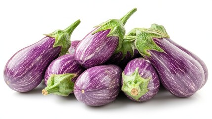 A pile of fresh, striped eggplants isolated on a white background.