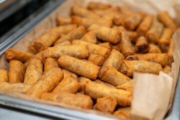 Vegetable spring rolls in a tray catered at an event as an appetizer 