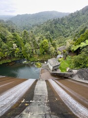 Fototapeta premium Water flowing over the Waitakere Reservoir Dam, Waitakeres, Auckland, Auckland, New Zealand.