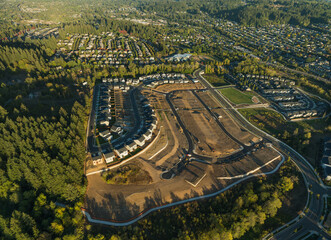 A view of a residential area with a lot of trees and houses © Anton