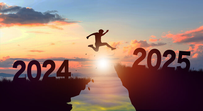 Welcome merry Christmas and Happy new year in 2025. Man jumping across the gap from 2024 to 2025 cliff with Sunset and Twilight Sky background.