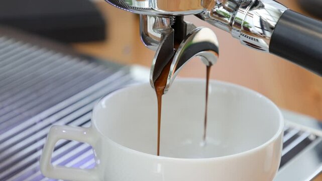 Espresso extraction, close up of the two diverter ports