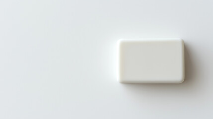 top down view, the image depicts a soap placed on the left side of a white background, leaving ample copy space on the right