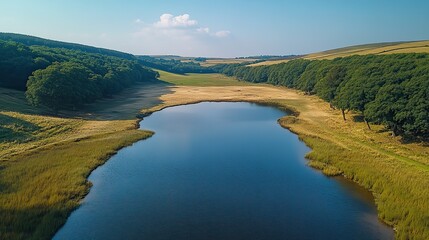 Obraz premium Aerial drone footage of a dried-up reservoir in the UK shows the devastating effects of drought and water shortages on the landscape.