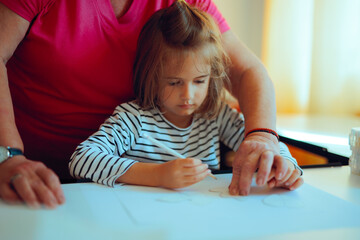 
Art Teacher Showing Little Girl How to Have Precision 
Kindergarten professor teaching template tracing technique 
