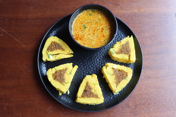 Maswadi, a traditional Maharashtrian dish cooked with cooked gram flour dough rolled with spicy...