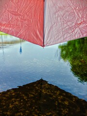 red umbrella on the lake