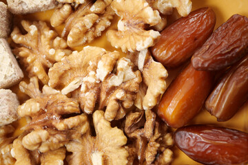 A Delicious and Attractive Assortment of Fresh Walnuts and Sweet Dates Placed on a Plate