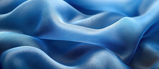 Obraz premium Closeup of a soft blue fabric with gentle waves.