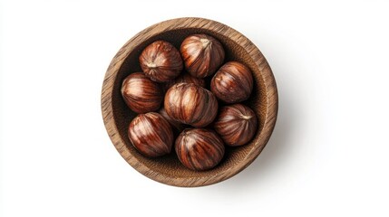 Obraz premium A wooden bowl filled with whole hazelnuts, shot from above on a white background.
