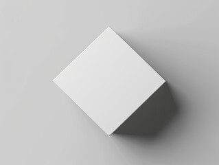 Square white box, matte finish, with rounded edges, on gray background, soft overhead lighting.