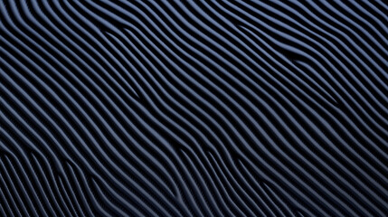 A close-up image of a dark blue textured surface with abstract wavy patterns. 