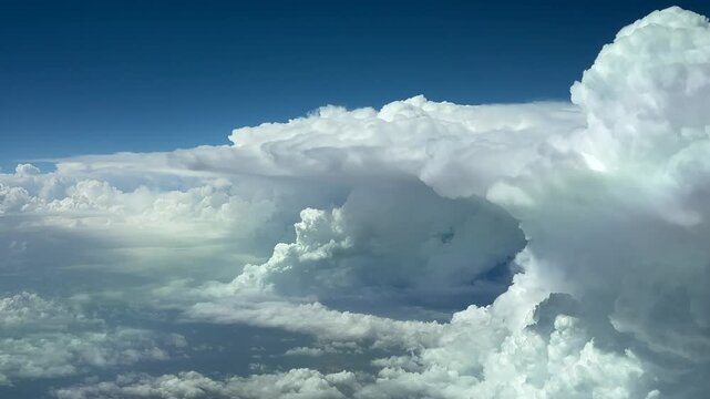 Massive storm clouds seen from above the sky: an unique pilot&rsquo;s perspective from a jet cockpit flying across a turbulent sky. 4K