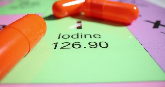 Orange tablet on the periodic table element iodine