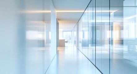 Obraz premium Blurred background of a modern office interior featuring glass windows and a polished floor, with a focus on the hallway
