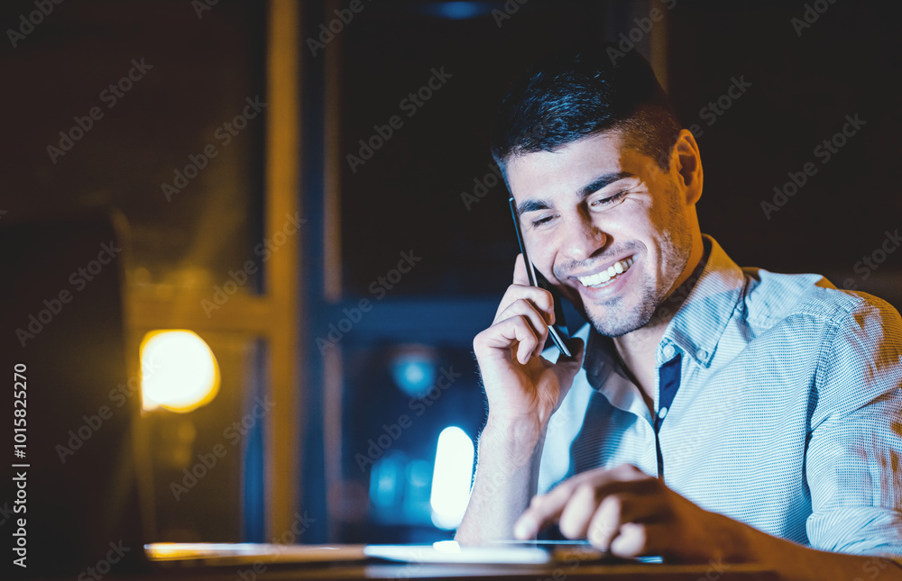 Poster happy employee. office manager talking on cellphone using tablet computer working overnight at workp