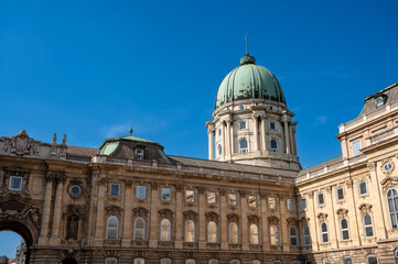 Budapest, Hungary. August 26, 2022. Shot with the big green dome of the Buda Castle sticking out over the building.