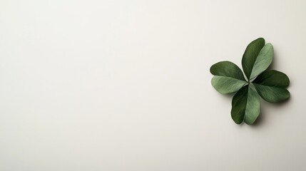 This artwork features a close-up view of a four-leaf clover in vibrant green, set against a soft beige backdrop, ideal for modern designs and seasonal elements