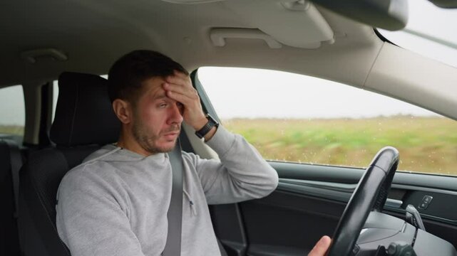 Tired man falling asleep while driving car on highway road. Sleepy male driver closes his eyes and lose concentration. Dangerous driving