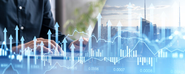 Businessman using laptop, graph diagrams with arrows and skyscrapers