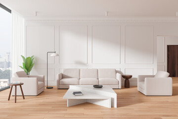 Traditional living room interior with chairs and couch near panoramic window