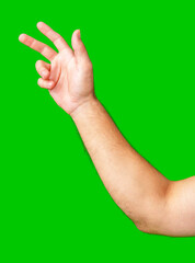 human arm gesturing with raised fingers against a bright green backdrop