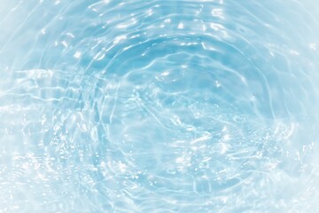 Blue water with ripples on the surface. Defocus blurred transparent blue colored clear calm water...