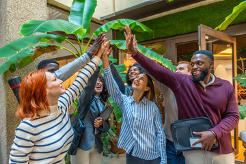 Diverse happy coworkers with hand put together