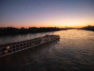Fototapeta premium A boat cruise through Bratislava in the evening provides an unforgettable experience of the flow of the Danube River.