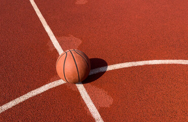Basketball ball on the urban court background.