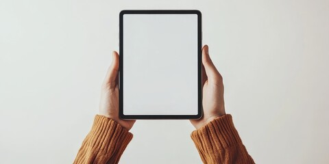 Hands holding tablet for technology presentation or demonstration
