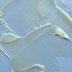 A smear of cream on a light background. Beauty concept.