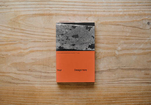 Mockup Of Customizable Vertical Book On Wooden Background