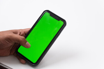 Phone mobile telephone with a vertical green screen in tram chroma key smartphone technology cell phone on white background isolate