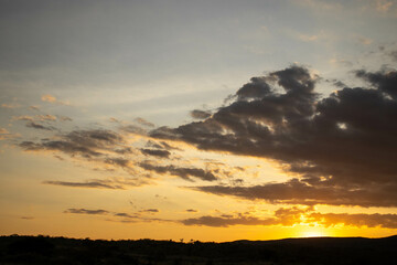 A moody sky at sunset in the hills 