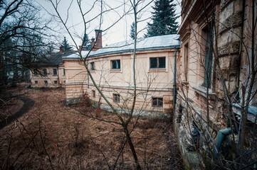 Abandoned Architecture in an Overgrown Landscape