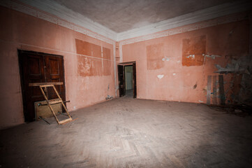 Abandoned Room with Faded Walls and Intriguing Shadows