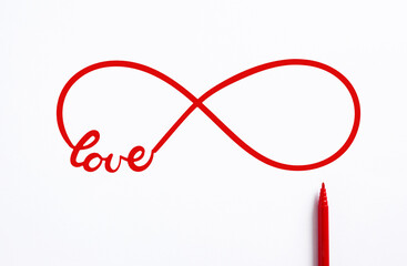 Red infinity symbol representing love with a red marker