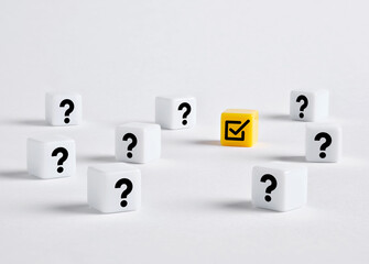 Yellow check mark cube surrounded by question mark cubes