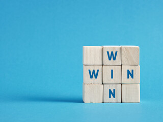 Win win situation concept with wooden cubes on blue background