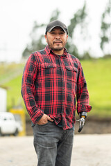 Portrait of middle-aged latin man with prosthetic hand outdoors