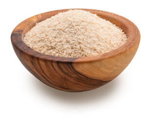 Cassava flour or manioc flour in wooden bowl on white background. File contains clipping path.