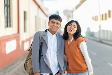 Fototapeta premium Portrait of two smiling brothers on the street