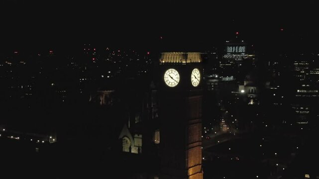 Aerial drone close up video of Big Ben and Houses of Parliament at night (After renovation)