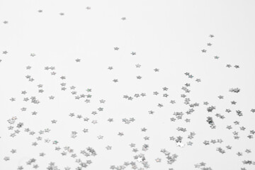 sparkles silver stars on white background with text place- Image